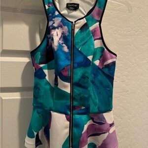 Bebe multicolored peplum top size XS